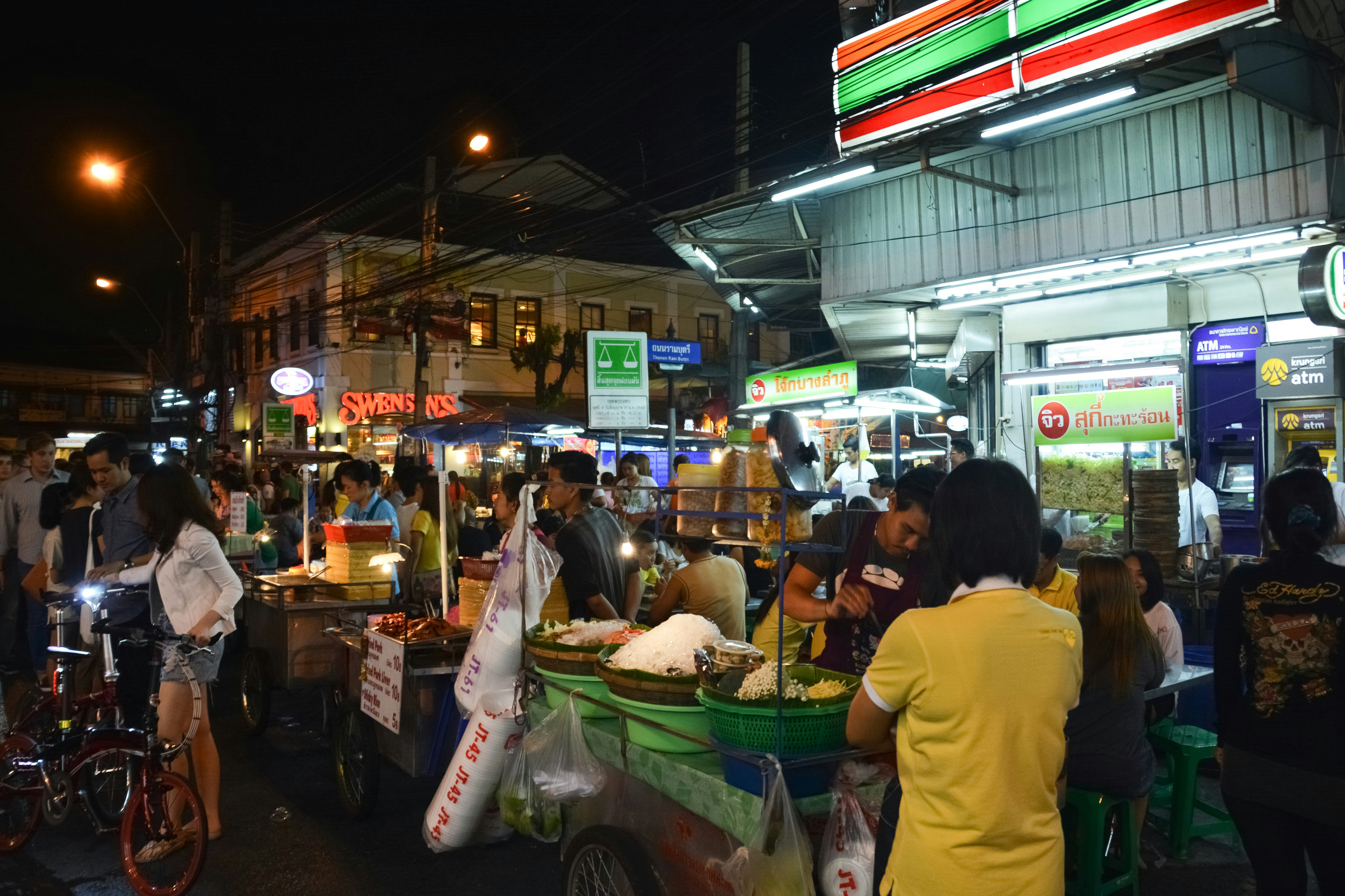 people in market during night time